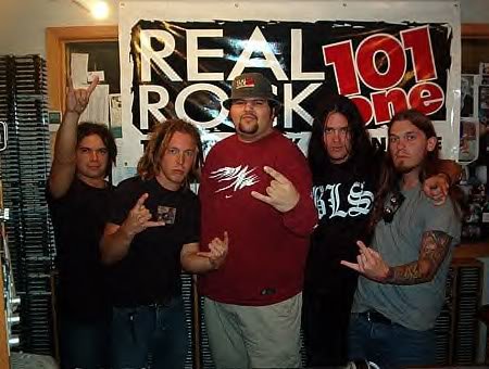 Bryan and members of Shinedown posing at the Real Rock 101.1 studio