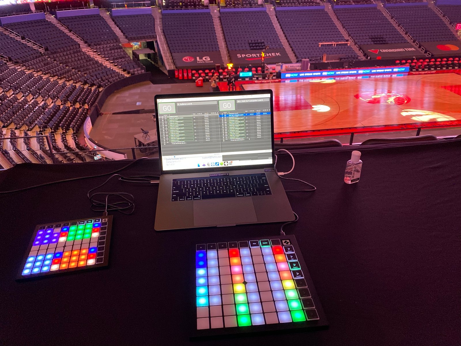 Sound sweetener laptop setup overlooking the Raptors court at Scotiabank Arena