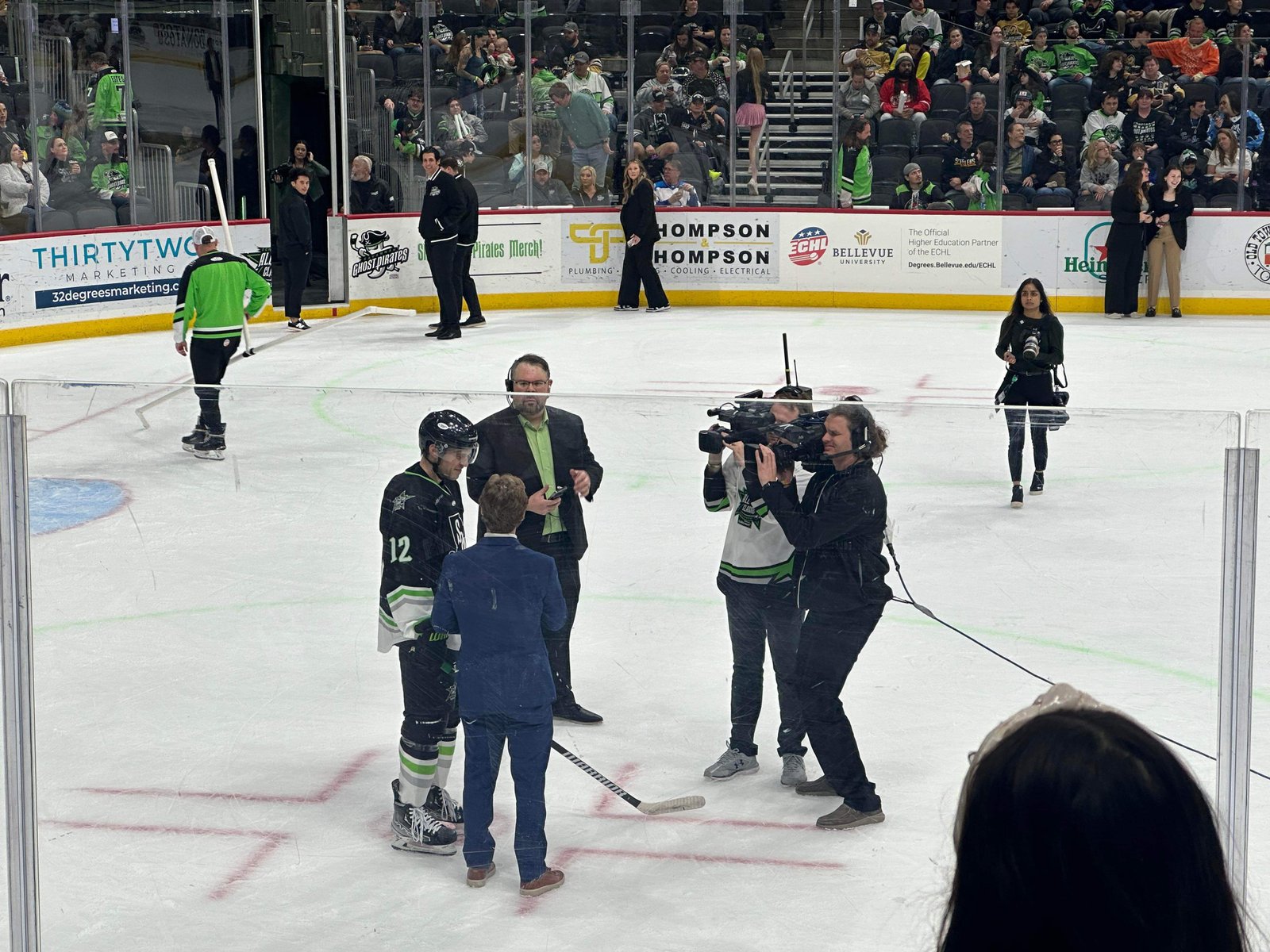 GPTV camera crew filming an on-ice player interview