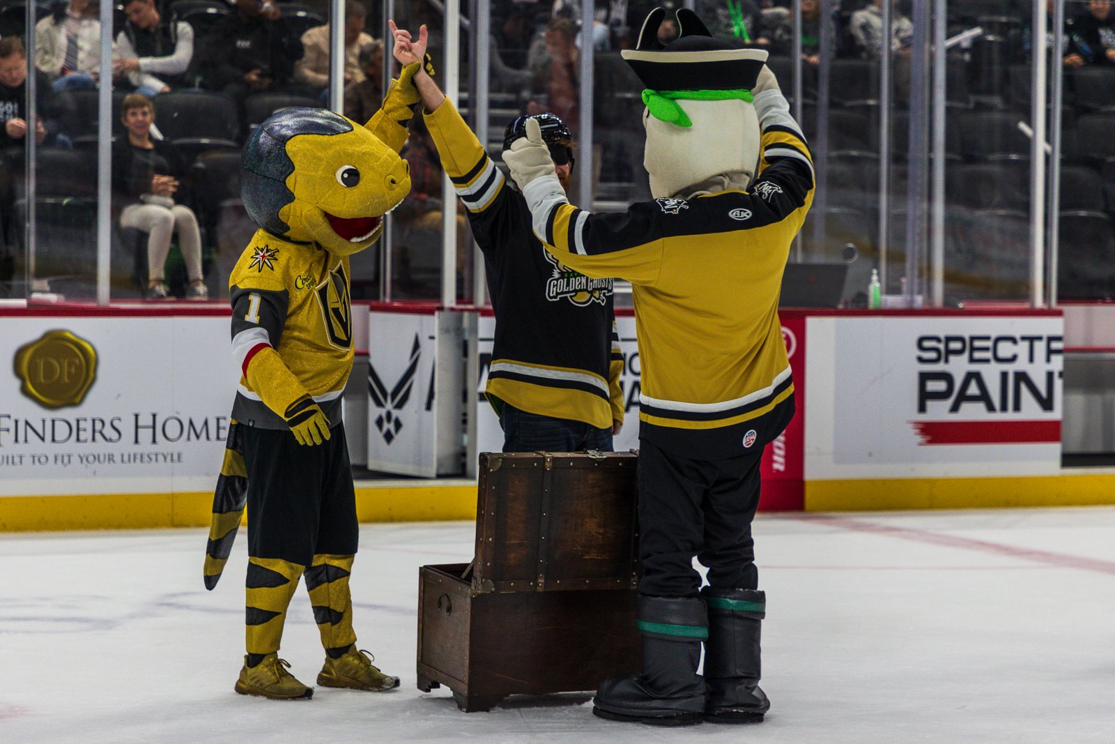 Fans waving gold glowsticks during the Golden Ghosts takeover
